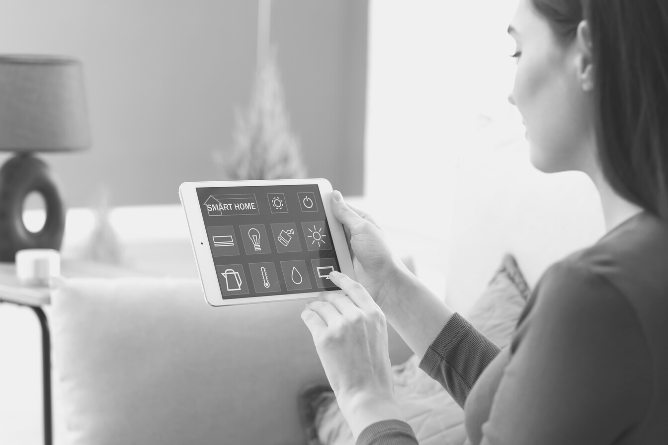 Young Woman Using Application of Smart Home Automation